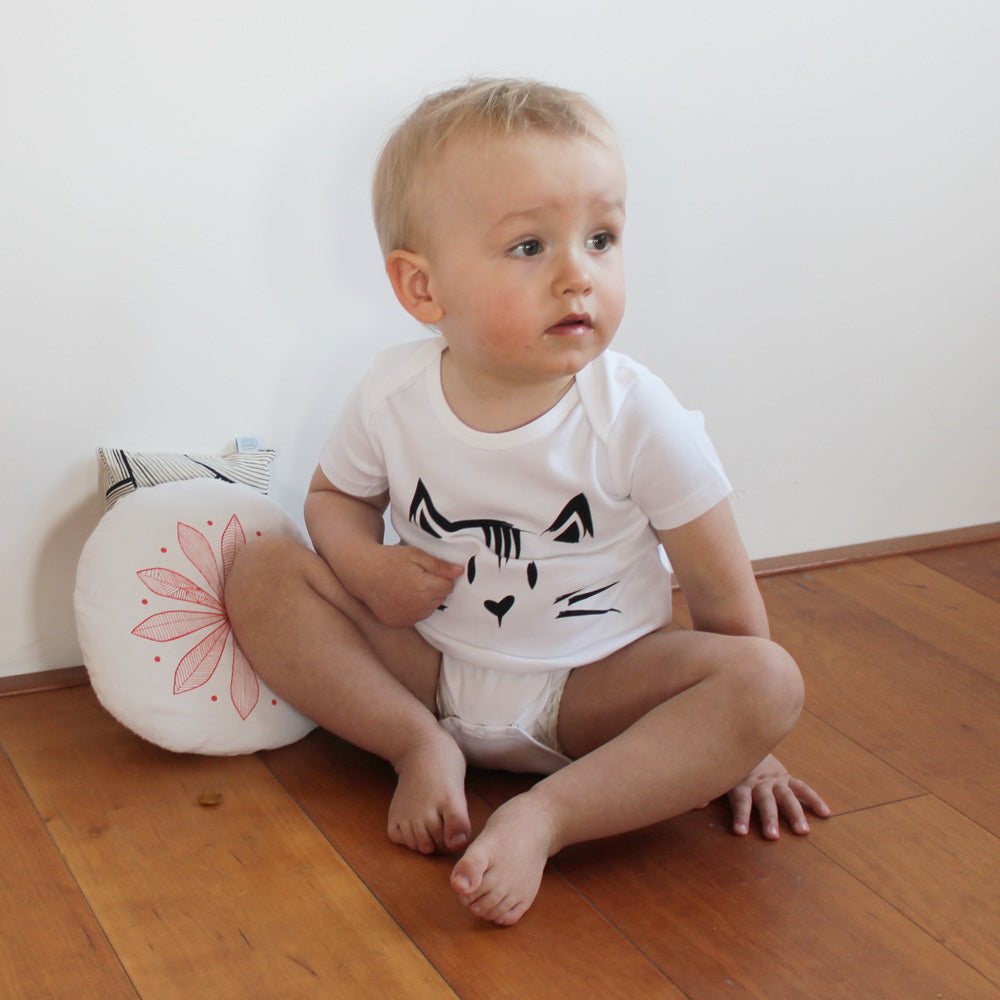 baby bodysuit with a printed cat and a tail in the back